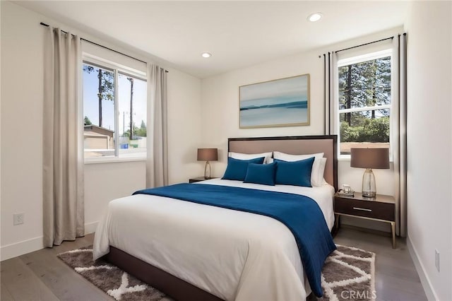 1890 Arrowhead Dr, Paradise, CA 95969 - bedroom featuring multiple windows, wood finished floors, baseboards, and recessed lighting