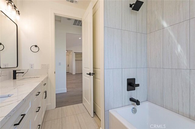 1890 Arrowhead Dr, Paradise, CA 95969 - bathroom with double vanity, baseboards, and washtub / shower combination