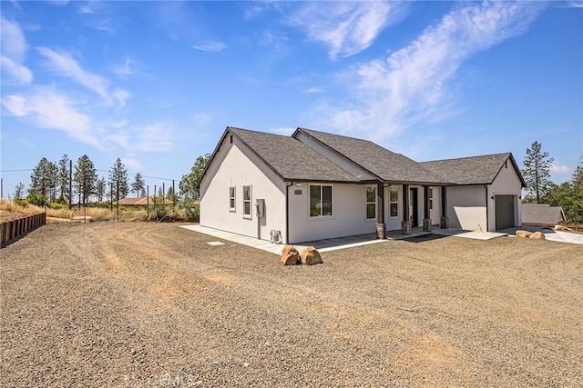 1890 Arrowhead Dr, Paradise, CA 95969 - view of front of property with driveway, a garage, stucco siding, and a shingled roof