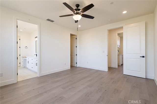 1890 Arrowhead Dr, Paradise, CA 95969 - unfurnished bedroom with light wood-style flooring, baseboards, recessed lighting, ensuite bath, and ceiling fan