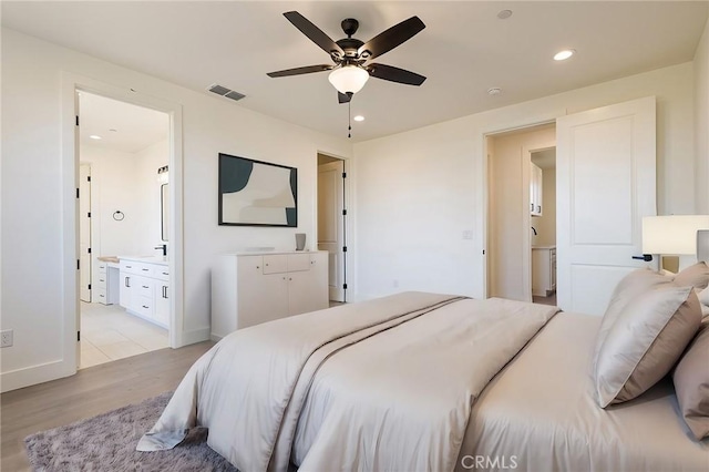 1890 Arrowhead Dr, Paradise, CA 95969 - bedroom featuring light wood-style floors, ensuite bathroom, recessed lighting, baseboards, and a ceiling fan