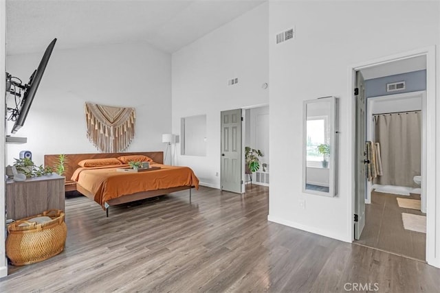 349 S Monte Vista St Unit 20, La Habra, CA 90631 - bedroom with wood finished floors, high vaulted ceiling, baseboards, and ensuite bathroom