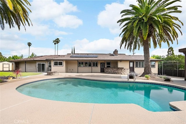 201 Valley View Dr, Oroville, CA 95966 - view of pool with a patio area, a storage shed, and an outbuilding