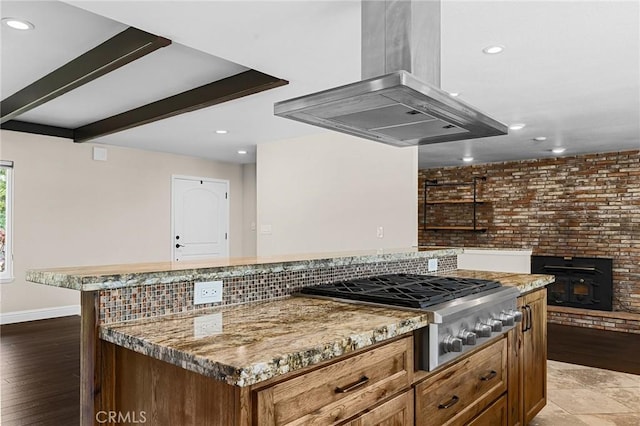 201 Valley View Dr, Oroville, CA 95966 - kitchen with island range hood, stainless steel gas stovetop, a kitchen island, recessed lighting, and baseboards
