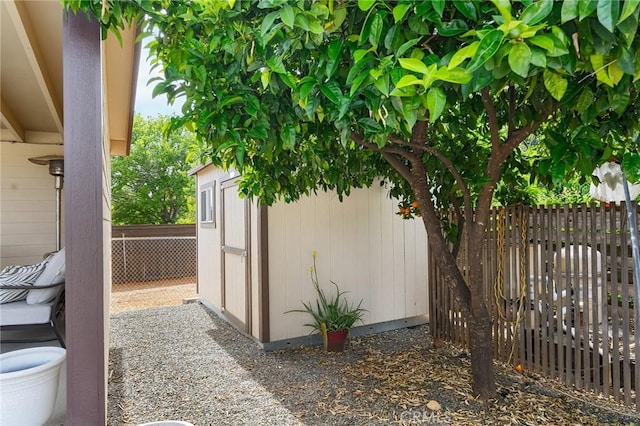 201 Valley View Dr, Oroville, CA 95966 - view of side of property featuring a storage shed, fence, and an outbuilding