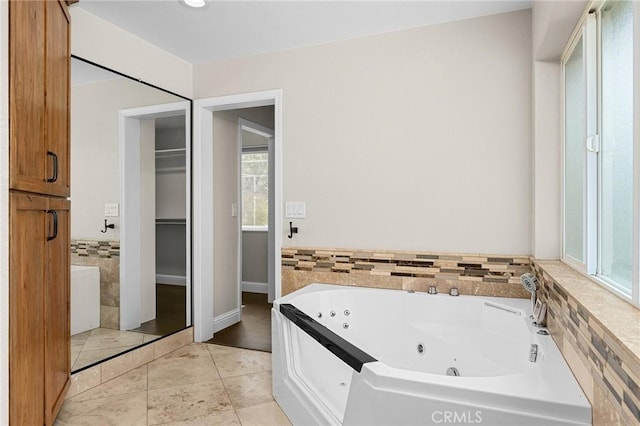 201 Valley View Dr, Oroville, CA 95966 - full bathroom with a jetted tub, tile patterned floors, and a walk in closet