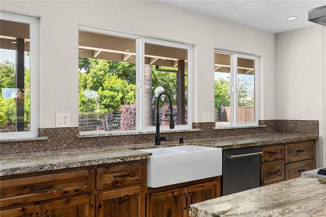 201 Valley View Dr, Oroville, CA 95966 - kitchen with a sink, decorative backsplash, and light stone counters