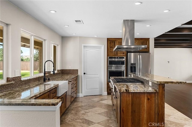 201 Valley View Dr, Oroville, CA 95966 - kitchen with a sink, island range hood, stainless steel appliances, dark stone counters, and recessed lighting
