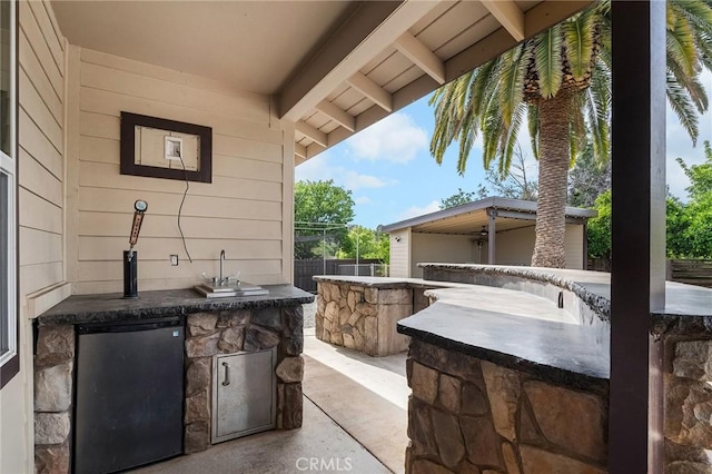 201 Valley View Dr, Oroville, CA 95966 - view of patio / terrace featuring an outdoor kitchen and fence
