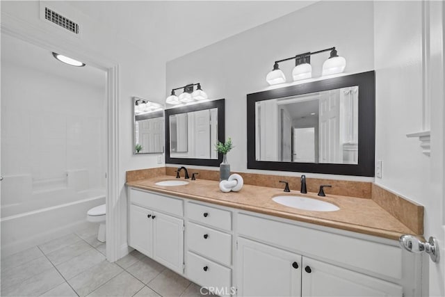 50 Bluff Cove Dr, Aliso Viejo, CA 92656 - full bath featuring toilet, double vanity, tile patterned floors, and washtub / shower combination
