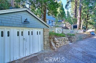 27048 State Highway 189, Blue Jay, CA 92317 - garage featuring a storage shed
