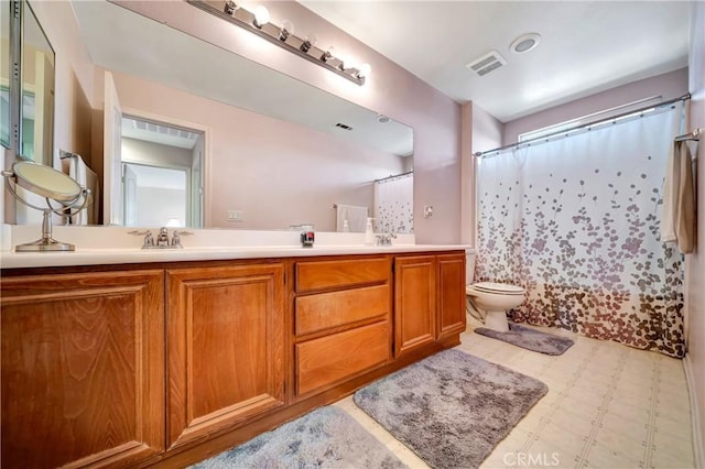 bathroom with tile patterned floors, double vanity, toilet, and a shower with shower curtain