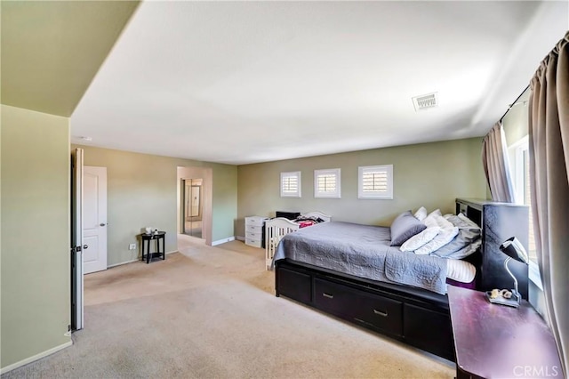 bedroom featuring carpet flooring and baseboards