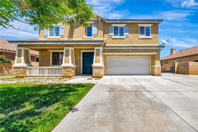 view of front of home with a porch, stone siding, an attached garage, and stucco siding
