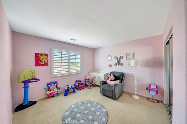 recreation room with carpet floors and baseboards