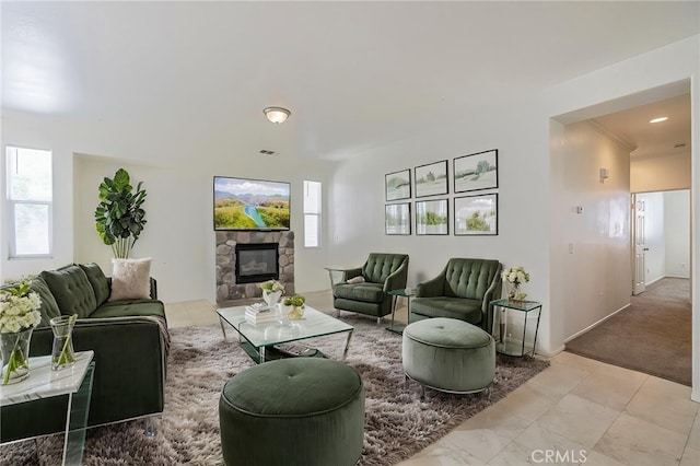 43839 58th St W, Lancaster, CA 93536 - living room featuring a stone fireplace and light carpet