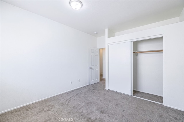 43839 58th St W, Lancaster, CA 93536 - unfurnished bedroom with carpet floors, a closet, and baseboards
