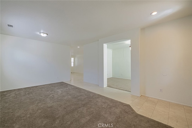43839 58th St W, Lancaster, CA 93536 - empty room with light colored carpet, light tile patterned floors, and recessed lighting