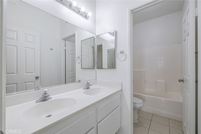 43839 58th St W, Lancaster, CA 93536 - full bathroom with toilet, double vanity, tile patterned flooring, and bathing tub / shower combination