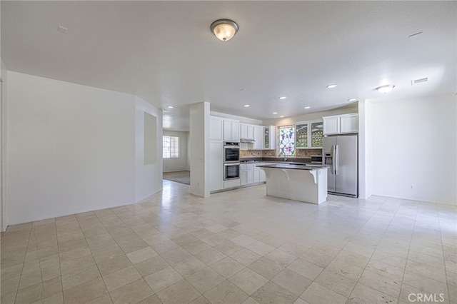 43839 58th St W, Lancaster, CA 93536 - kitchen featuring stainless steel appliances, open floor plan, plenty of natural light, and recessed lighting