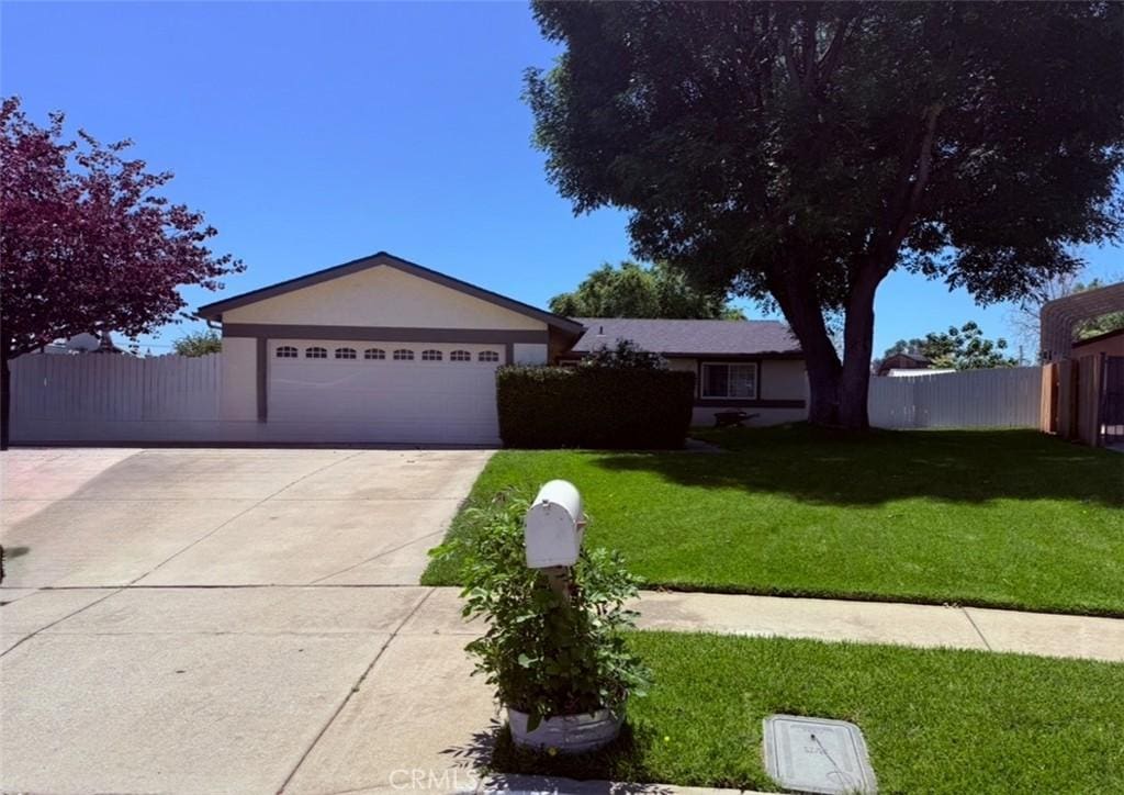 6256 Ramona St, Alta Loma, CA 91737 - ranch-style house featuring stucco siding, an attached garage, and concrete driveway