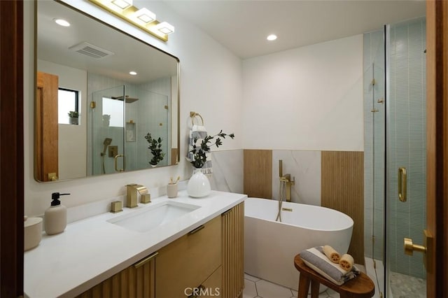 2136 Echo Park Ave, Los Angeles, CA 90026 - full bathroom featuring a shower stall, vanity, a freestanding tub, recessed lighting, and tile patterned floors