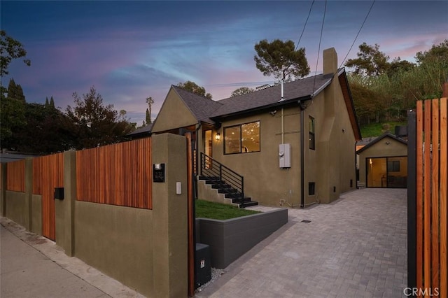 2136 Echo Park Ave, Los Angeles, CA 90026 - view of home's exterior featuring stucco siding and a chimney