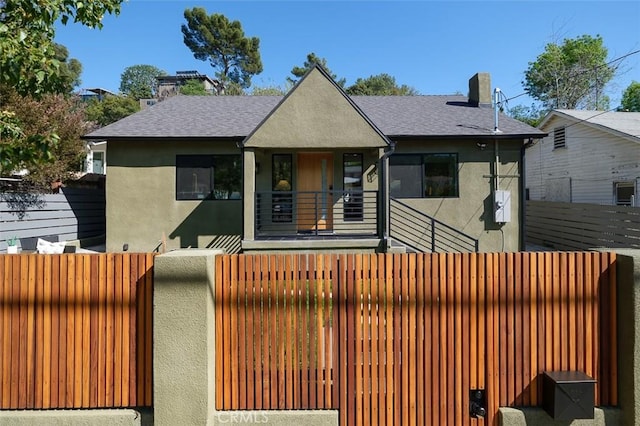 2136 Echo Park Ave, Los Angeles, CA 90026 - bungalow featuring stucco siding, a chimney, a shingled roof, and a balcony