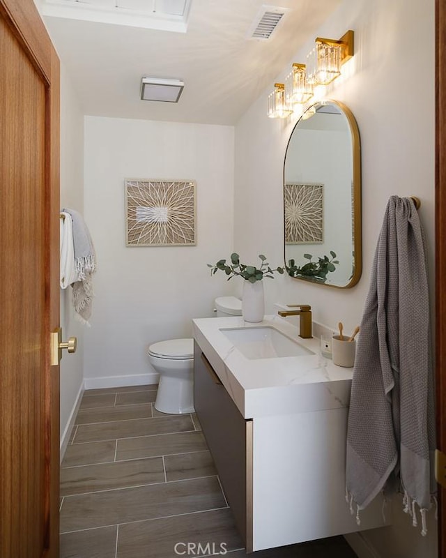 2136 Echo Park Ave, Los Angeles, CA 90026 - half bathroom with toilet, vanity, and baseboards