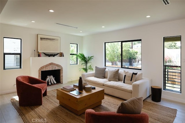 2136 Echo Park Ave, Los Angeles, CA 90026 - living area with a brick fireplace, recessed lighting, and baseboards
