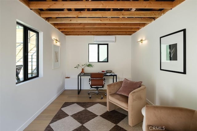 2136 Echo Park Ave, Los Angeles, CA 90026 - home office with an AC wall unit, light wood-style floors, baseboards, and beam ceiling