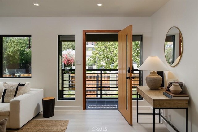2136 Echo Park Ave, Los Angeles, CA 90026 - doorway with wood finished floors, recessed lighting, baseboards, and plenty of natural light