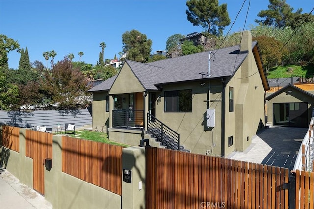 2136 Echo Park Ave, Los Angeles, CA 90026 - bungalow-style home featuring stucco siding, a fenced front yard, and a shingled roof