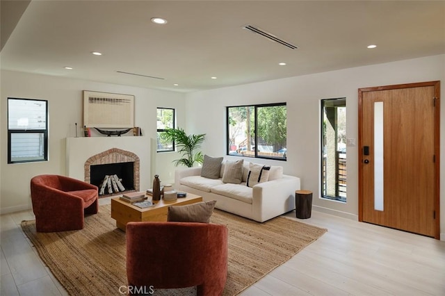 2136 Echo Park Ave, Los Angeles, CA 90026 - living area with recessed lighting, a fireplace, light wood finished floors, and baseboards