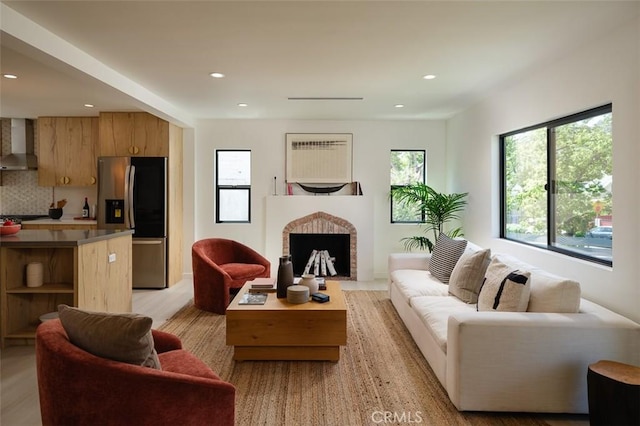 2136 Echo Park Ave, Los Angeles, CA 90026 - living area with recessed lighting, light wood-style floors, and a fireplace