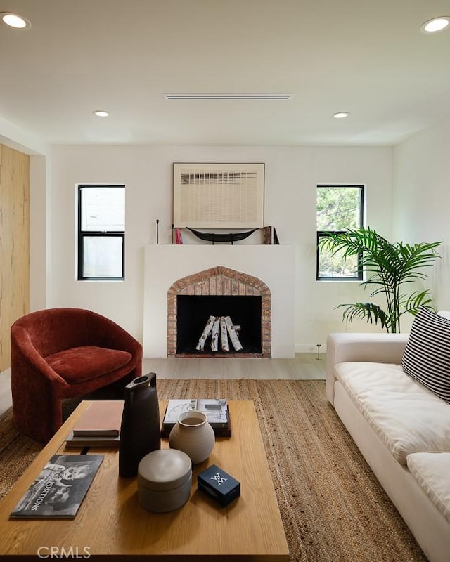 2136 Echo Park Ave, Los Angeles, CA 90026 - living area featuring recessed lighting, a fireplace, and wood finished floors