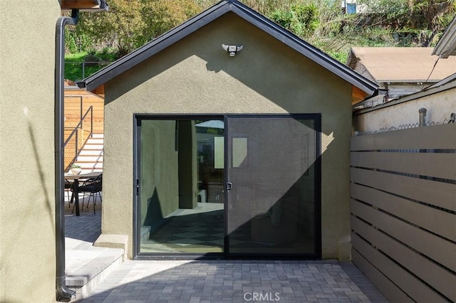 2136 Echo Park Ave, Los Angeles, CA 90026 - rear view of property with stucco siding and a patio
