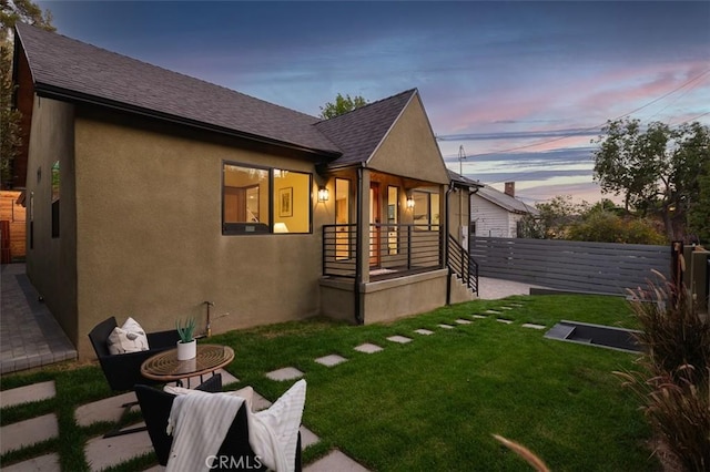2136 Echo Park Ave, Los Angeles, CA 90026 - rear view of house featuring stucco siding and roof with shingles