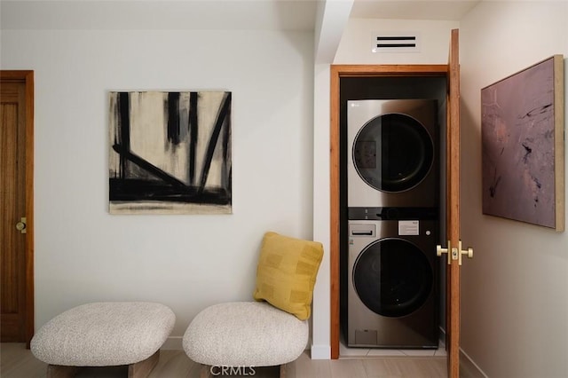 2136 Echo Park Ave, Los Angeles, CA 90026 - laundry room with stacked washing machine and dryer and baseboards