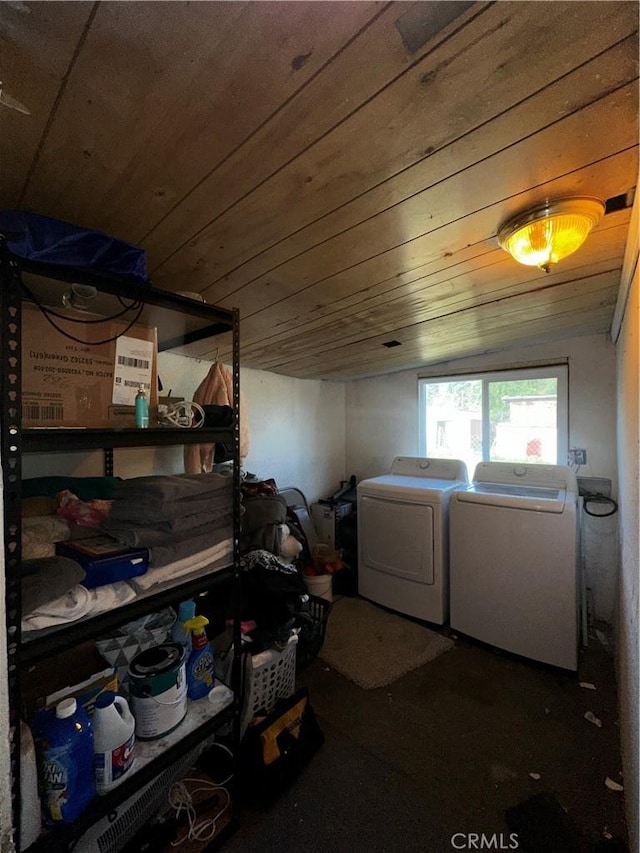 clothes washing area with wooden ceiling and separate washer and dryer