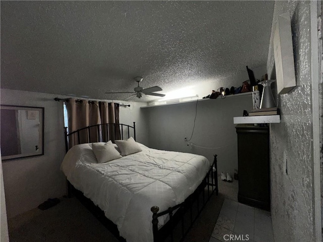 bedroom featuring a textured ceiling and ceiling fan