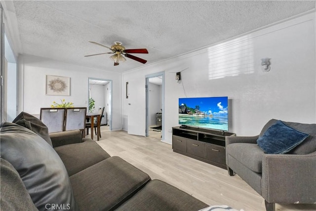9446 La Grande St, Rancho Cucamonga, CA 91701 - living area featuring wood finished floors, a ceiling fan, and a textured ceiling