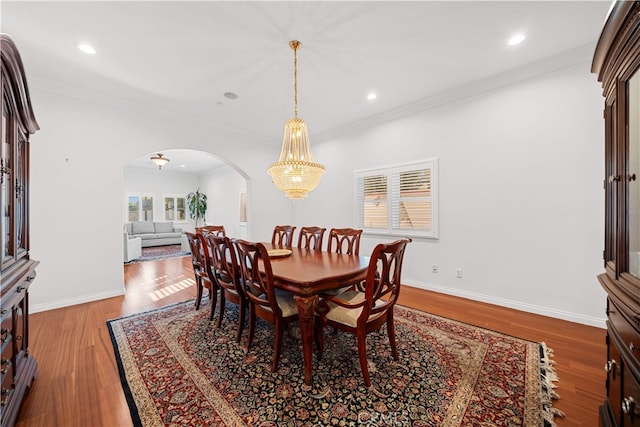 1621 Bryan Ave, Tustin, CA 92780 - dining space with arched walkways, plenty of natural light, recessed lighting, wood finished floors, and ornamental molding