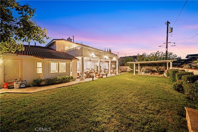 1621 Bryan Ave, Tustin, CA 92780 - view of grassy yard with a ceiling fan and a patio