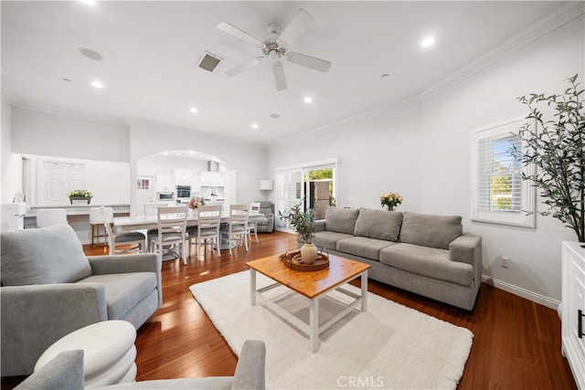 1621 Bryan Ave, Tustin, CA 92780 - living room with arched walkways, crown molding, a ceiling fan, dark wood-type flooring, and recessed lighting
