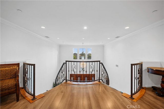 1621 Bryan Ave, Tustin, CA 92780 - hallway with an upstairs landing, wood finished floors, recessed lighting, and ornamental molding