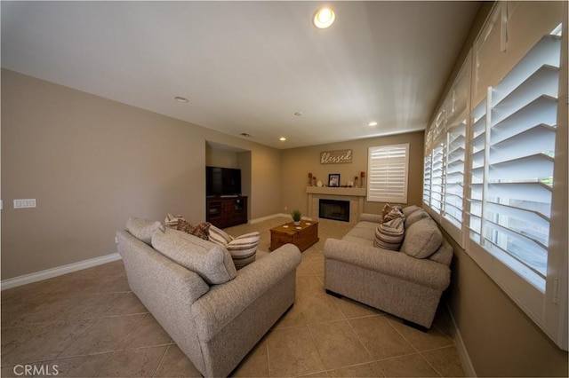 35197 Hogan Dr, Beaumont, CA 92223 - living room featuring light tile patterned floors, a fireplace, baseboards, and recessed lighting