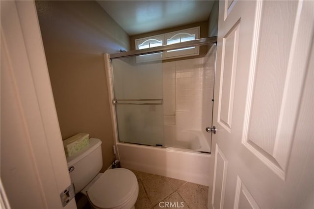 35197 Hogan Dr, Beaumont, CA 92223 - bathroom with toilet, shower / bath combination with glass door, and tile patterned floors
