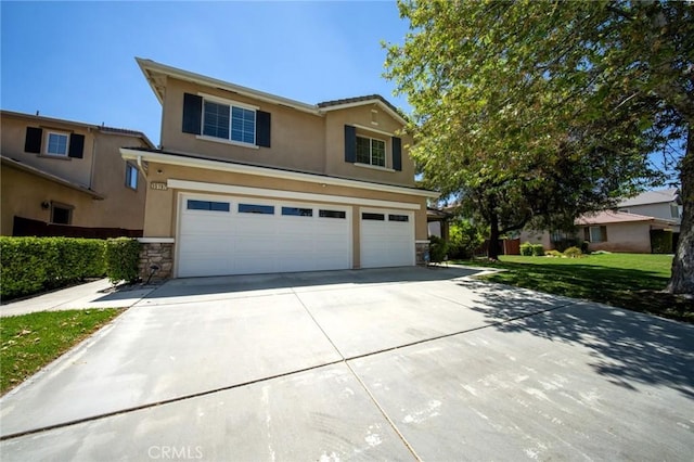 35197 Hogan Dr, Beaumont, CA 92223 - traditional-style home featuring a garage, stucco siding, concrete driveway, stone siding, and a front yard