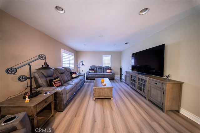 35197 Hogan Dr, Beaumont, CA 92223 - living room featuring light wood-style floors, baseboards, and recessed lighting